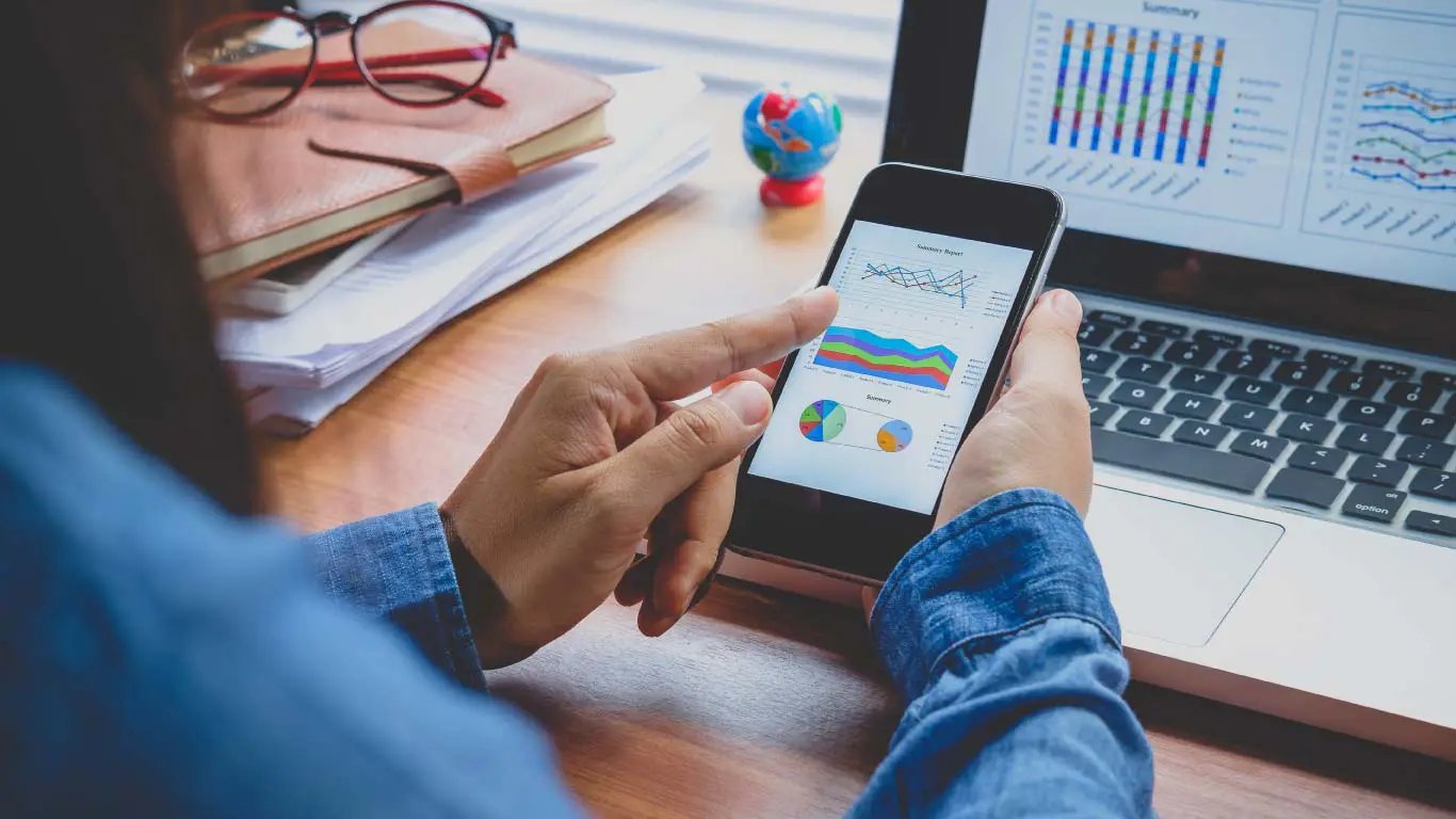 Data and graphs on screen and smartphone