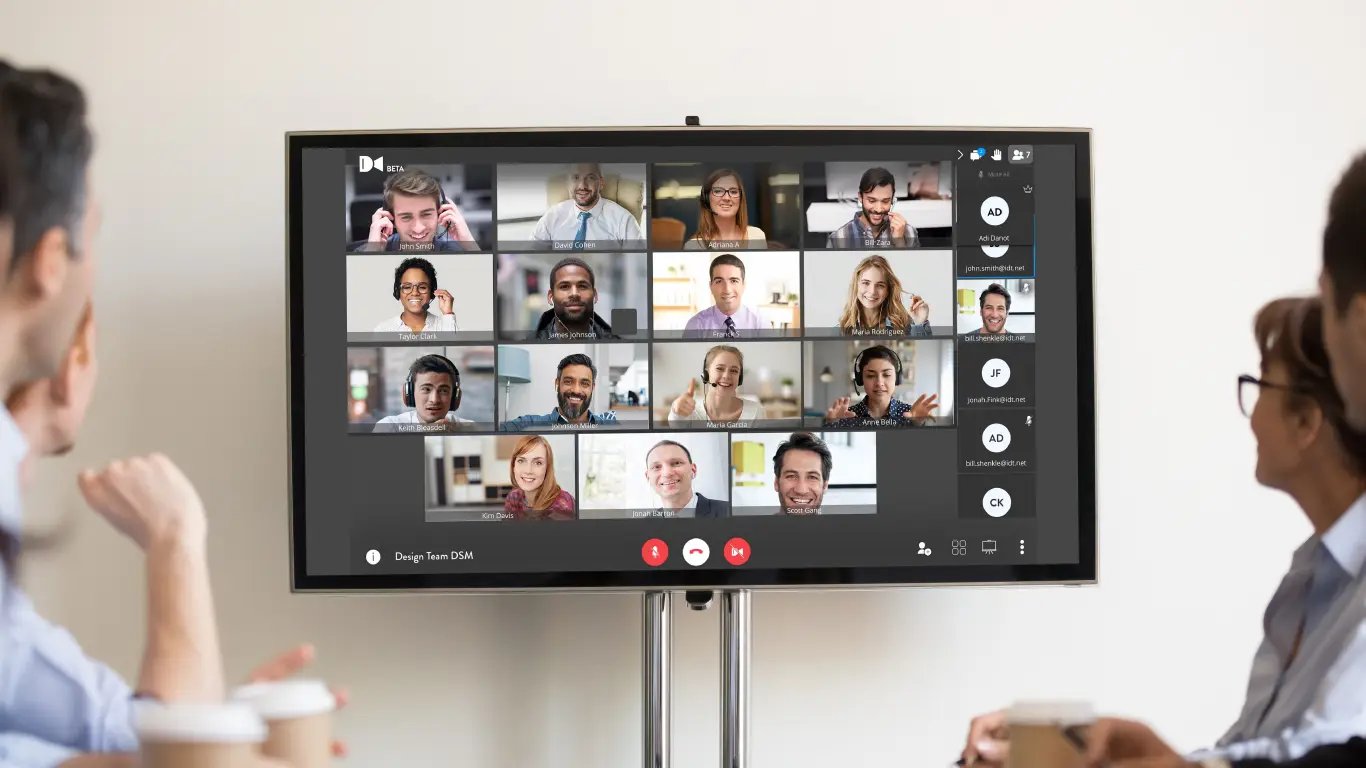 In person team on video conference meeting with others