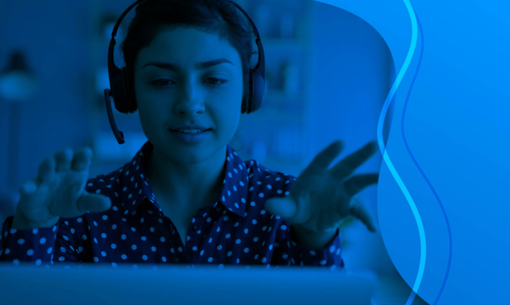agent with headset talking while looking at screen