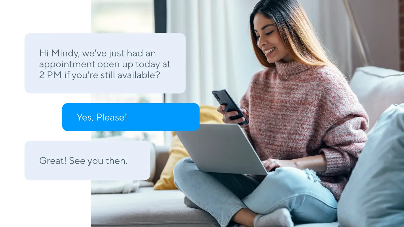 woman sitting on couch exchanging business SMS