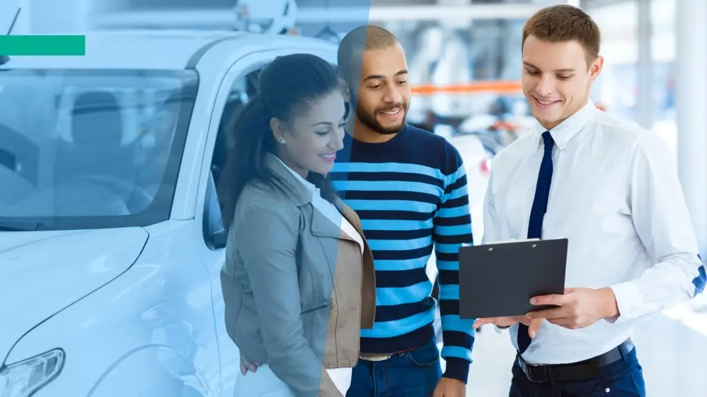 Car dealership manager talks with the customers