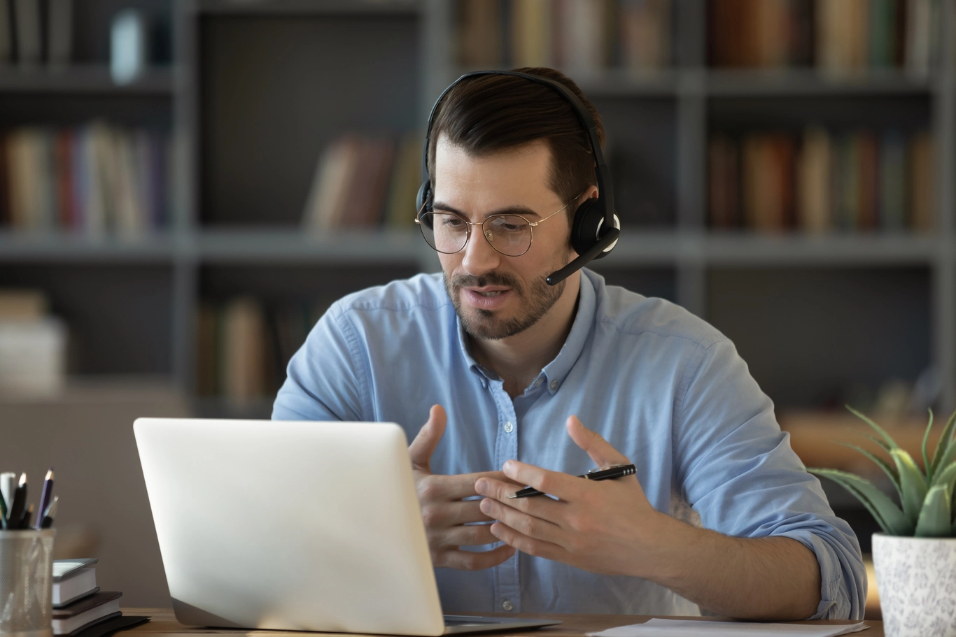 man-explaining-while-in-home-office